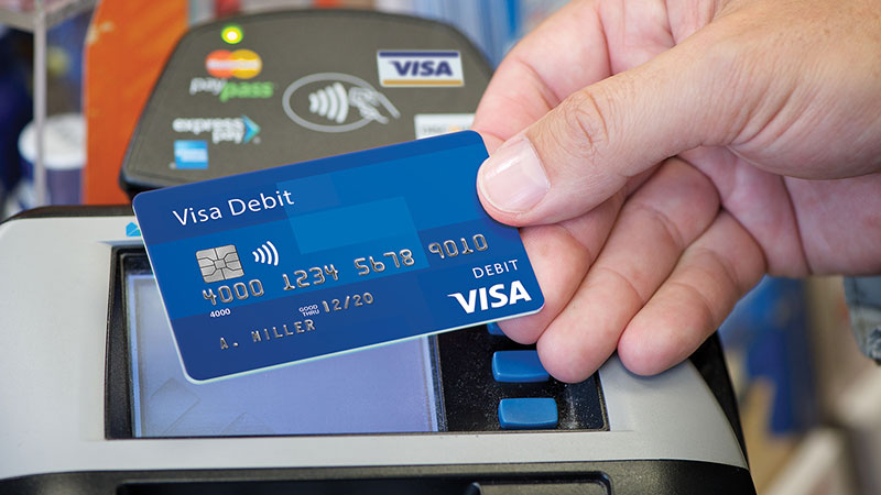 man holding visa debit